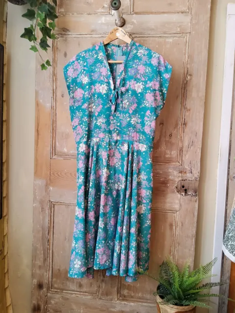 Vintage 1970s does 1950s floral fit and flare dress.