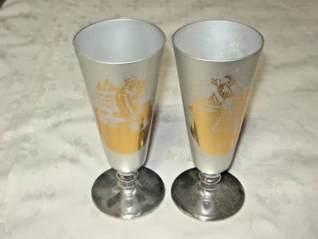 A Pair of Retro Fiesta Ware Anodised Aluminium Golfer & Bowler Trophy Goblets