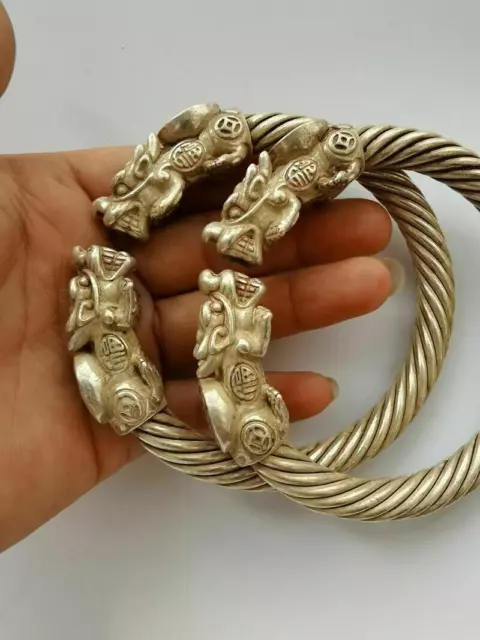 A Pair Old Chinese tibet silver handcarved dragon head wealth Lucky Bracelet