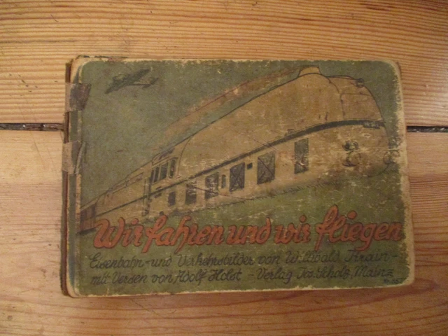 A541	Altes Leporello Bilderbuch „Wir fahren und wir fliegen“, Hartpappe