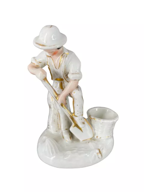 Tintero-Plumier de porcelana, siglo XIX, “Hombre con pala”