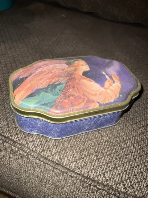 https://www.picclickimg.com/XYYAAOSwwpplljeo/Vintage-Christmas-Tin-Can-with-Angel-Holding-A.webp