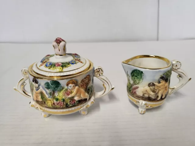 Vintage Capodimonte Italy Heavily Embossed Footed Cherubs Sugar & Creamer Set