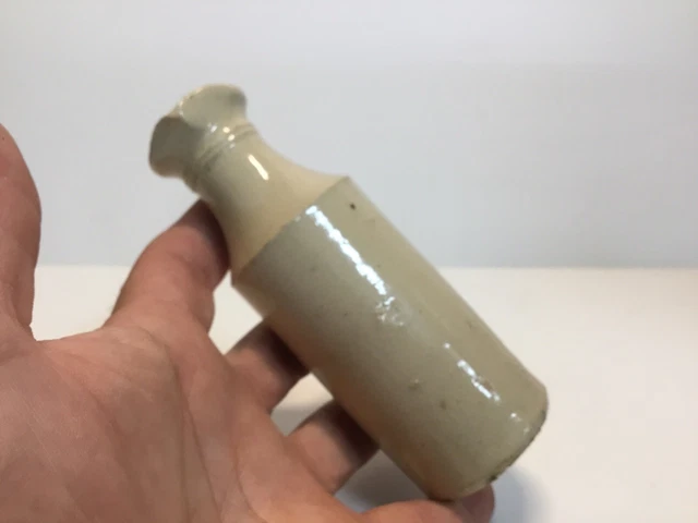 Slender Antique Cream Colored Stoneware Master Ink Bottle With Pour Spout.