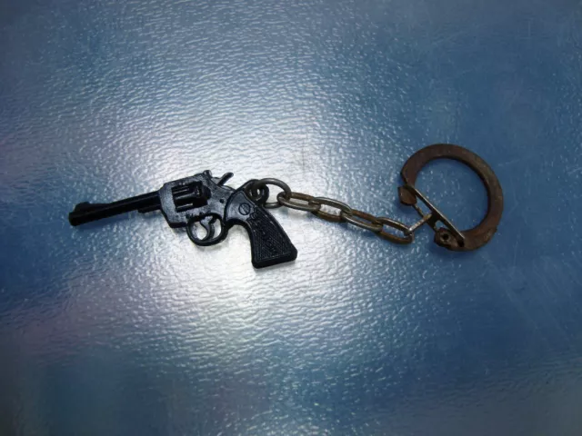 Ancien porte clefs pistolet plastique noir et blanc  années 60