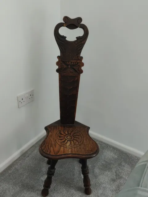 Antique carved dark oak spinning chair