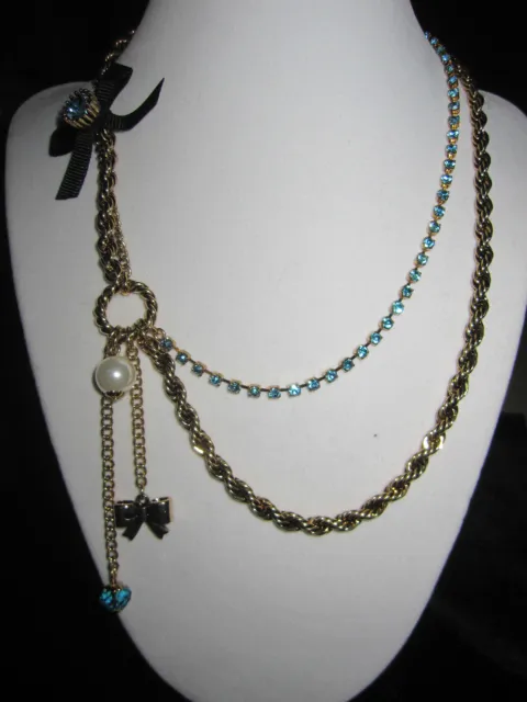 Betsey Johnson Iconic  Blue Bling With Gold Chain And Black Bow