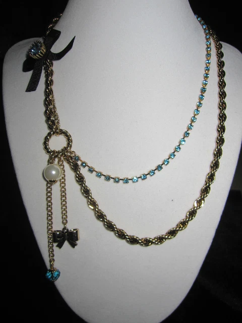 Betsey Johnson Iconic  Blue Bling With Gold Chain And Black Bow
