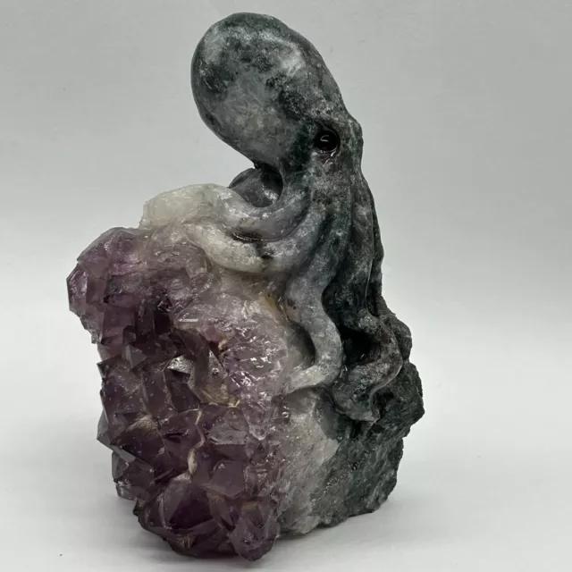 Mineral specimens of natural Marine amethyst.A hand-carved octopus.