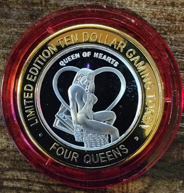 2009 FOUR QUEENS $10 RED Cap .999 Silver Strike Queen of HEARTS
