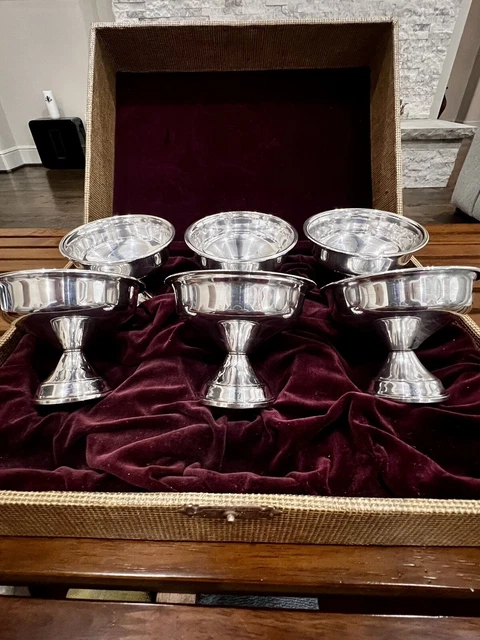 vintage national sterling silver with weighted base. 6 cups in original box