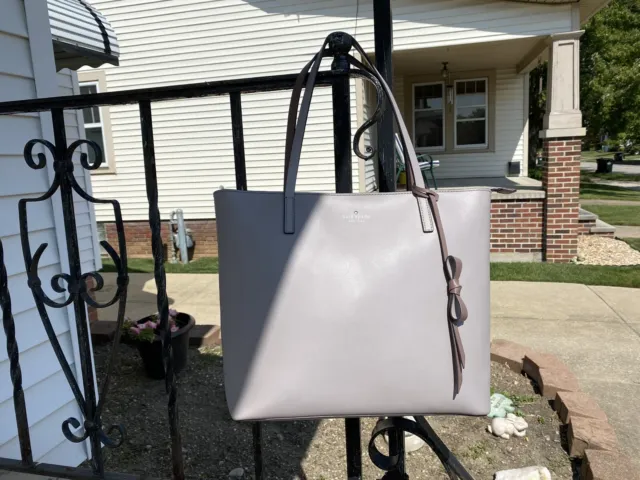 Kate Spade Lawton Way Tote In Light Taupe With Bow Accent And Zipper Closure.
