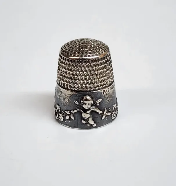 Antique Simons Bros Sterling Silver Thimble Cupid Cherubs & Flowers “Marie” 1905