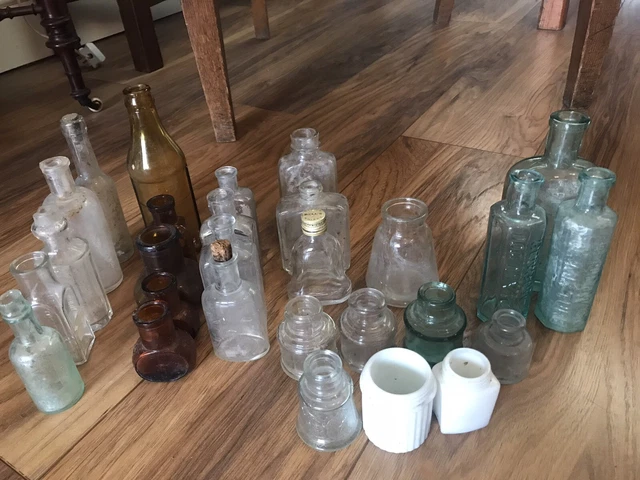 28 Antique and vintage bottles varying sizes and colours - require cleaning