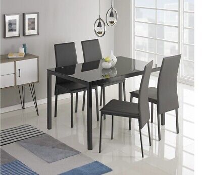 Mesa de comedor de vidrio Lido y 4 sillas negras