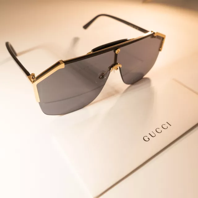 Gucci GG0291S 001 Unisex Shield Sunglasses in Black/Gold with Grey Lens 100% UV