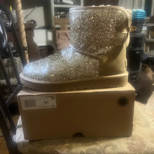 Ugg Classic Mini Bailey Bow Cosmos Gold 1107324 Size 7 Woman’s Boots (Authentic)