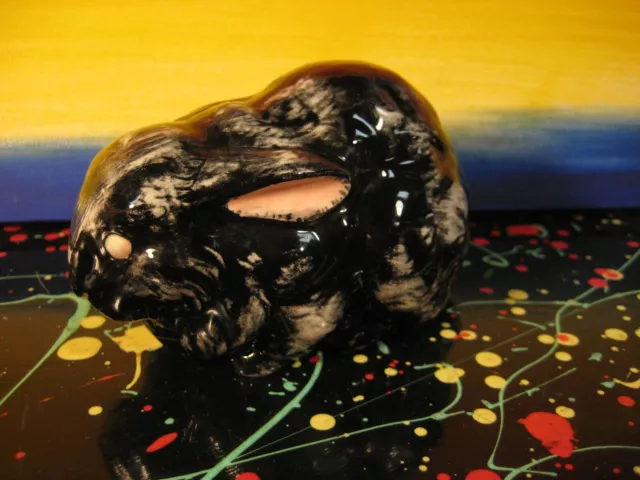 Black Ceramic Uncanny Bunny Figurine with Pink Eyes and White Spot Markings