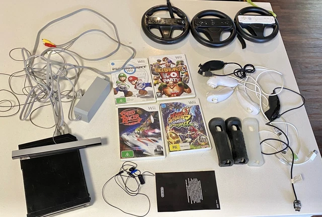 Wii Console, five games and controllers.