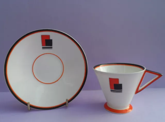 A Shelley Art Deco "Red Block" 11972 Eve shape Mode pattern coffee cup & saucer.