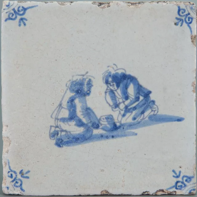 Nice Dutch Delft Blue tile, child play, mid 17th. century.