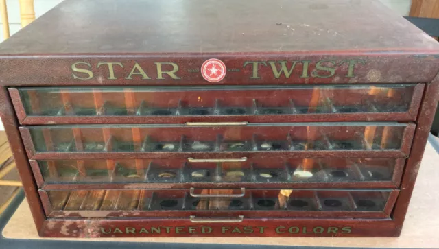 Antique Star Twist metal 4 drawer thread cabinet with wooden spools