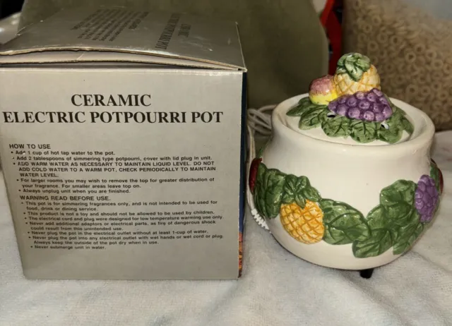 https://www.picclickimg.com/YMsAAOSwD2xljHUO/Ceramic-Electric-Potpourri-Pot-With-Box-Used-Fruit.webp