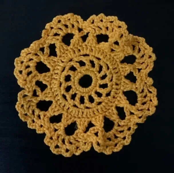 Handmade crochet round small orange doily