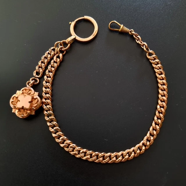 ancienne chaine montre a gousset en métal argenté avec breloque en