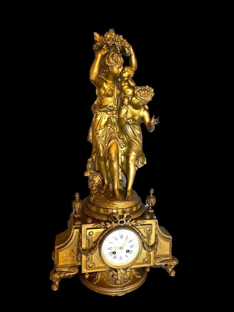French Louis XVI style table / mantle clock in gilded alloy. Made 19th century