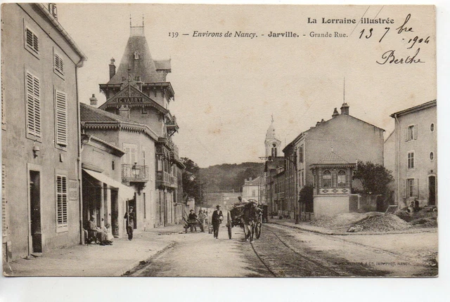 JARVILLE - Meurthe et Moselle - CPA 54 - la grande rue - magasins - attelage
