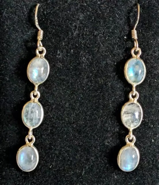 A pair of sterling silver and moon stone drop earrings