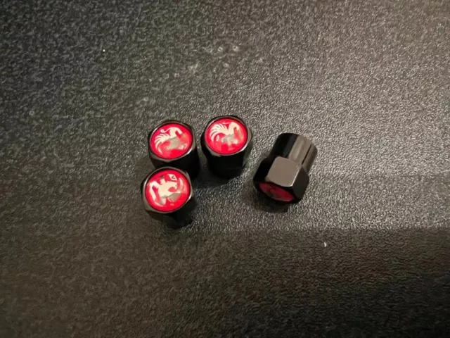 Shiny Black Vauxhall Red Dust Valve Caps - (Set of 4)