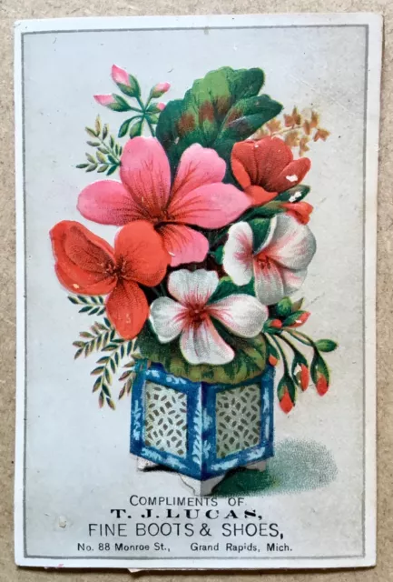 Victorian Trade Card embossed flowers compliments of T. J. Lucas Boots Shoes