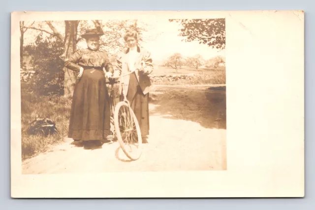 Two Women Pose Outdoors With Bicycle Postcard