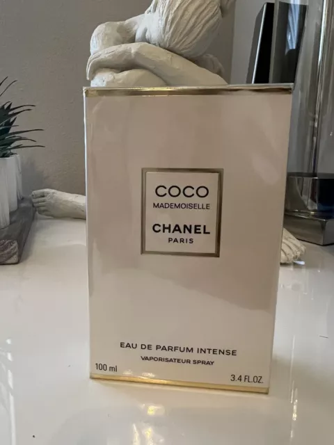 coco chanel pearls, perfume, and the little black dress