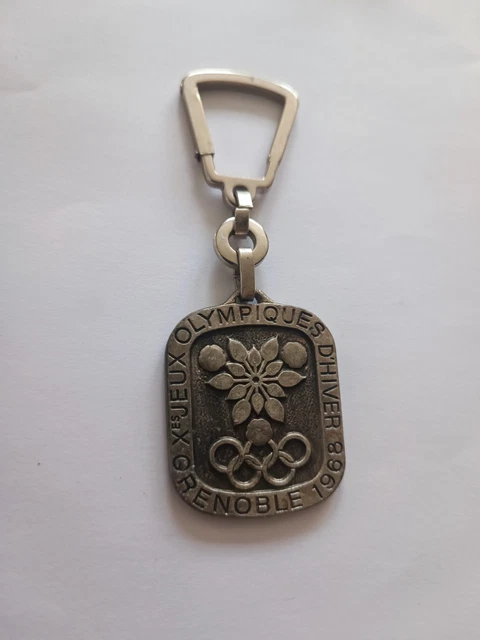 Porte clés - J.O Grenoble 1968 - DAUPHI NET Pressing Grenoble