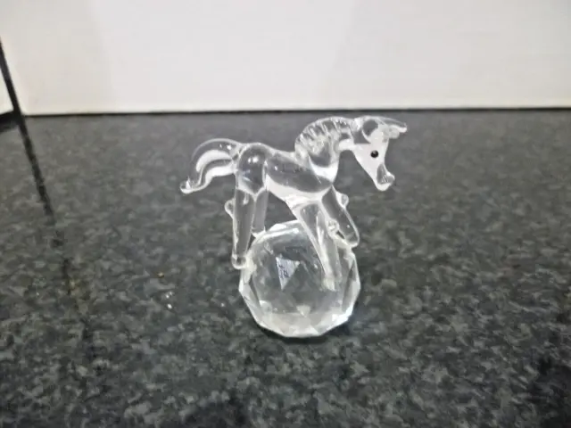 Crystal figurine of a horse on a crystal Ball