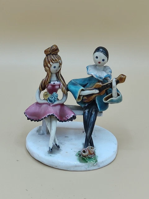Ancienne statuette couple sur un banc Neuquelman en céramique