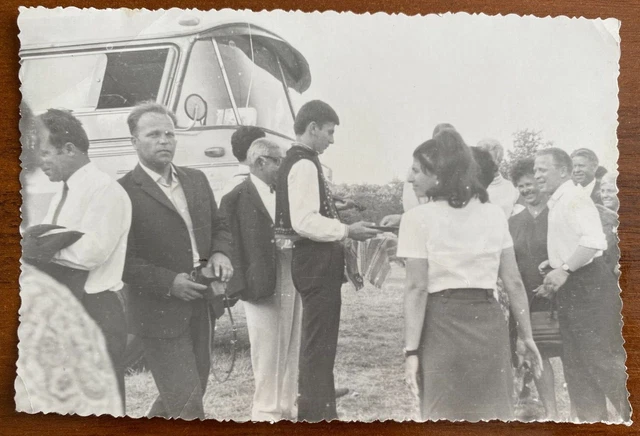 Beautiful guys and girls near the bus. Vintage photo