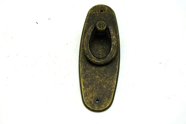 Cabinet pull handle on back plate solid brass with an aged bronze finish.