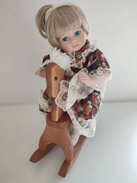Leonardo Porcelain Doll Collection on Rocking Horse