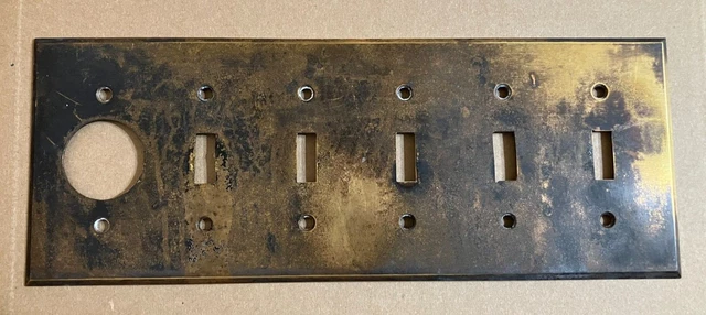 Antique Brass 5-gang switch plate with round outlet gang also
