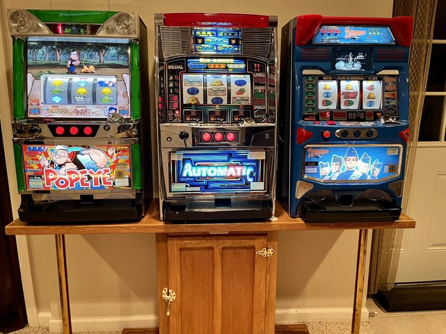3 Pachislo slot machines and cabinet for sale. Popeye/Thunderbirds/Automatic