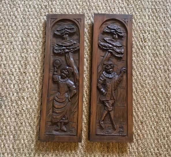 pair of character french antique carved wooden panels of male and female figures