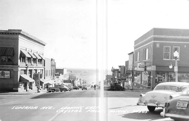 CRYSTAL FALLS Michigan postcard Upper Peninsula RPPC Superior Ave stores #57B