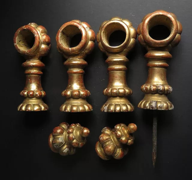 FOUR 19th CENTURY GESSO GILT WOODEN CURTAIN POLE  HOLDERS PLUS TWO POLE FINIALS