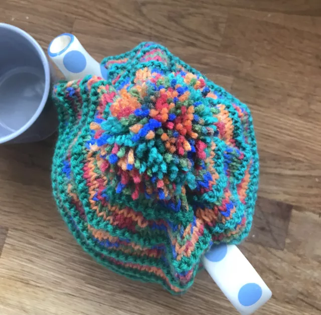 Handmade Knitted Vintage Style Tea Cosy In Green And Multi Coloured Stripes