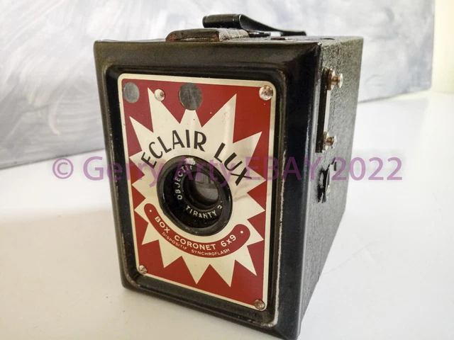 CÁMARA DE PELÍCULA CORONET ECLAIR LUX ROLL con caja de cuero.