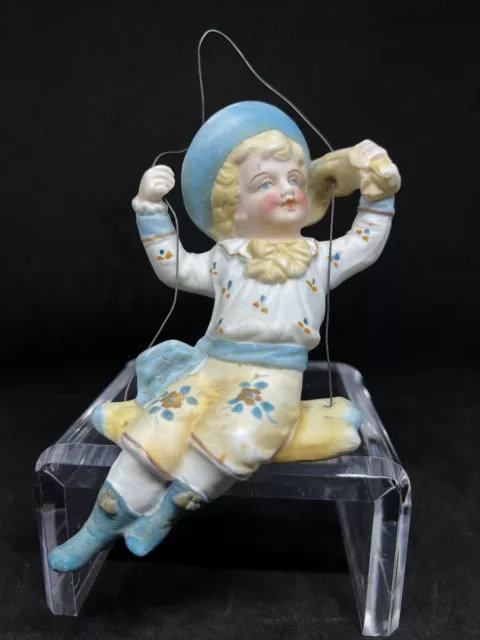 Antique German Porcelain Bisque Swinger-Young Girl Sitting On A Swing-Blue Cap